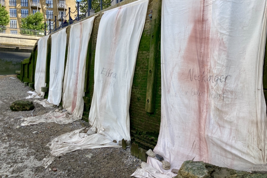 Installation view of Mary Lemley's banners on the Thames foreshore